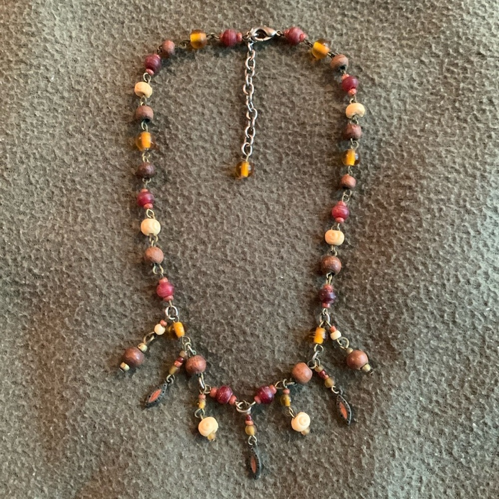Cute wooden and plastic bead necklace. Approximately 17 inches at the most.